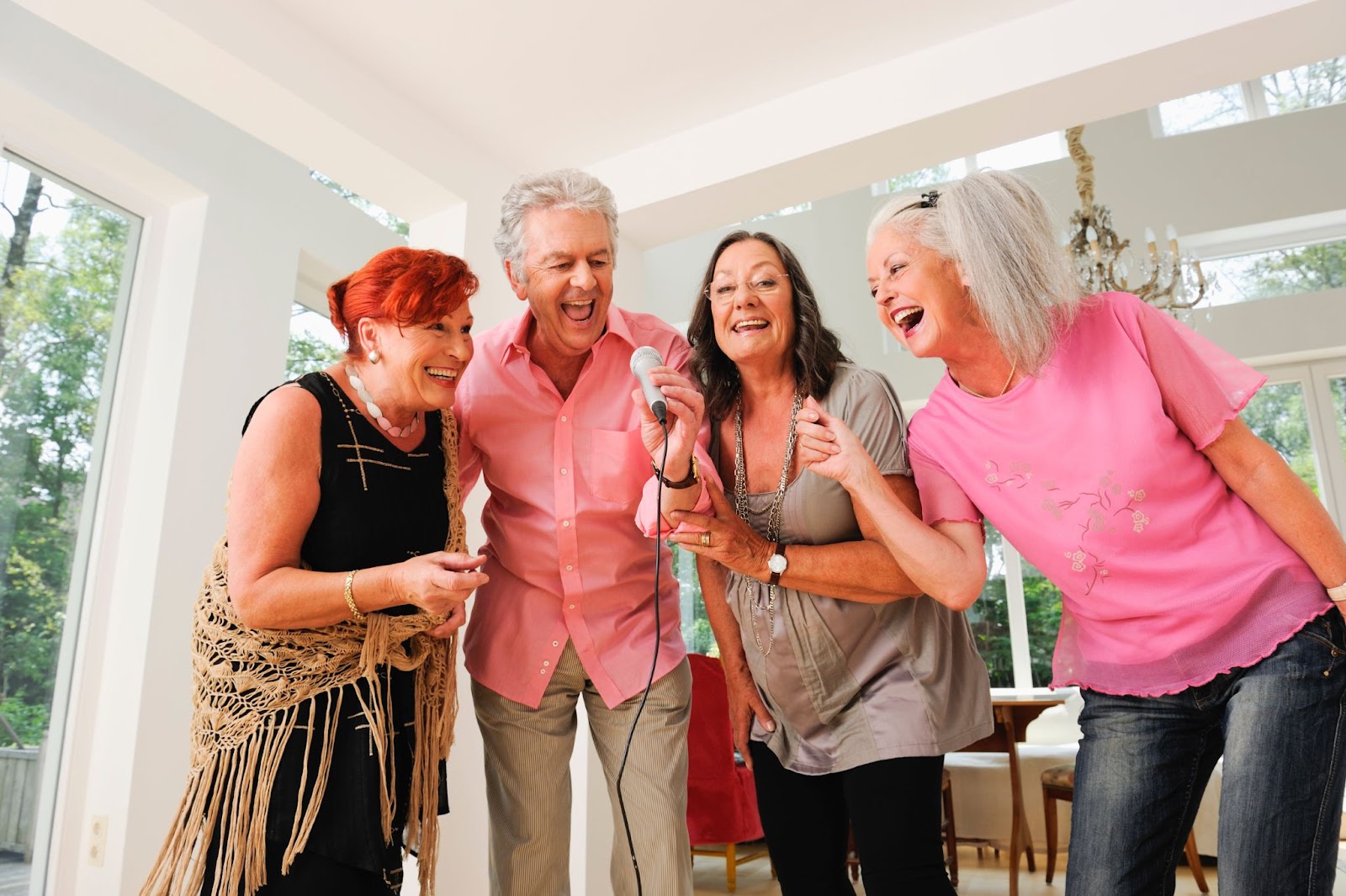 A group of older adults fostering connections through a joyful singing session.